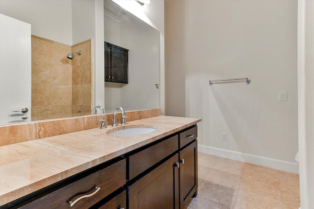 bathroom featuring tile patterned flooring and vanity