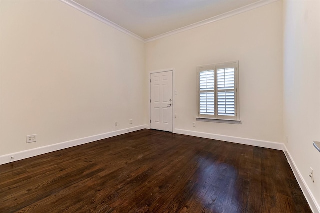 unfurnished room with ornamental molding and dark wood-type flooring