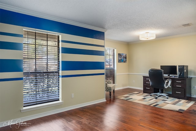 unfurnished office with dark wood-type flooring, a textured ceiling, and ornamental molding