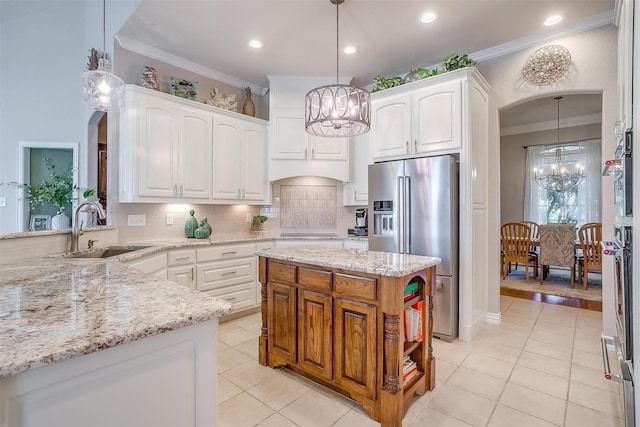 kitchen featuring sink, pendant lighting, white cabinetry, and stainless steel appliances