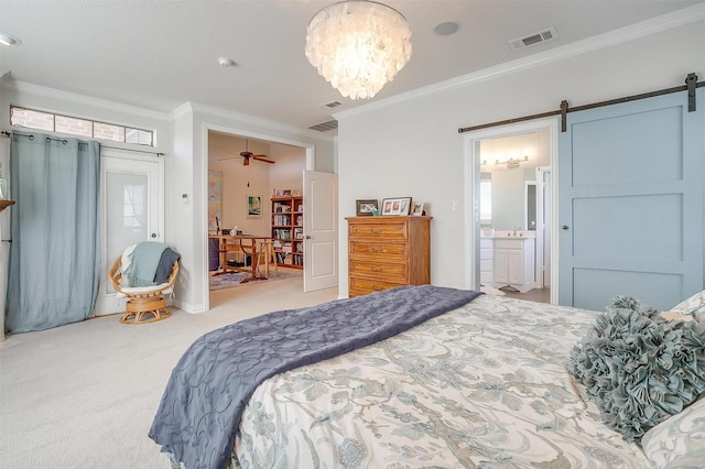 bedroom with ornamental molding, carpet floors, and a barn door