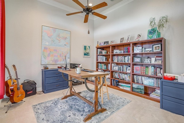 carpeted home office with ceiling fan and crown molding