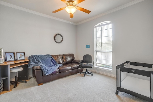 carpeted living room featuring ceiling fan and ornamental molding