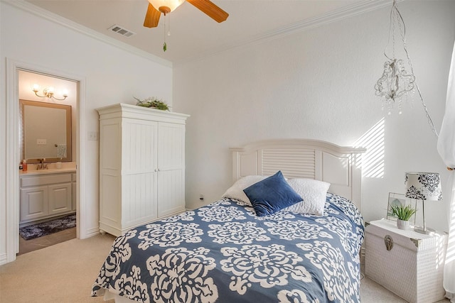 bedroom featuring ensuite bath, light colored carpet, ornamental molding, ceiling fan, and sink