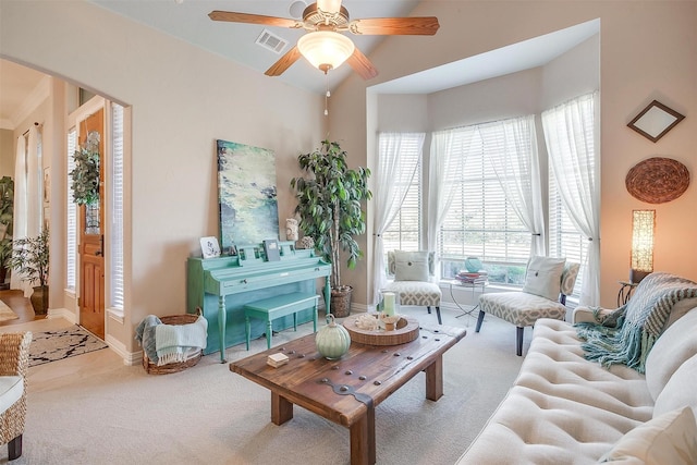 carpeted living room with lofted ceiling and ceiling fan