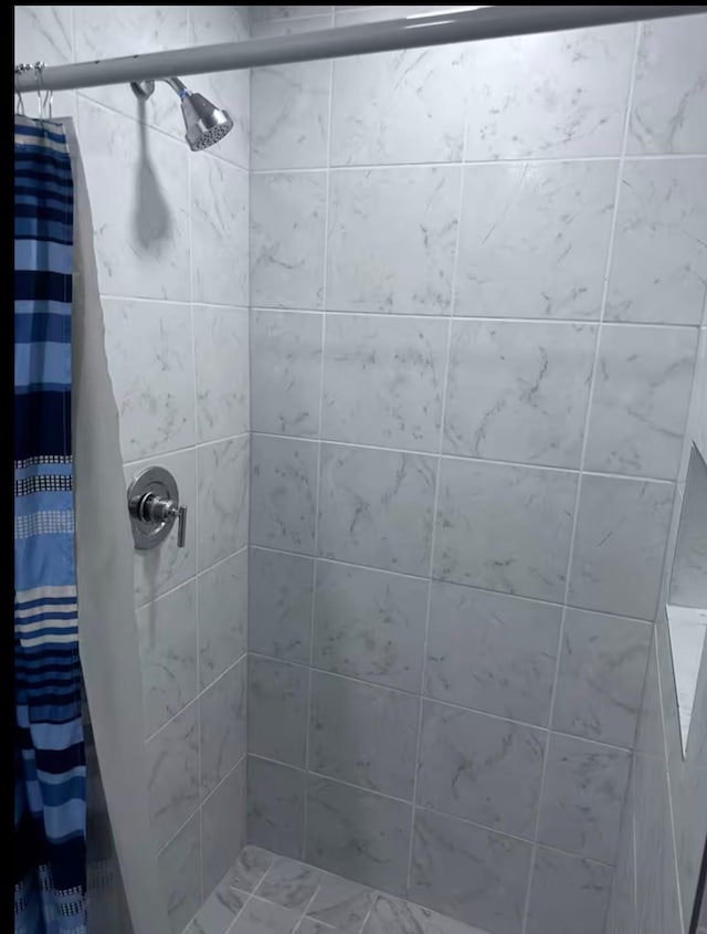 bathroom featuring walk in shower