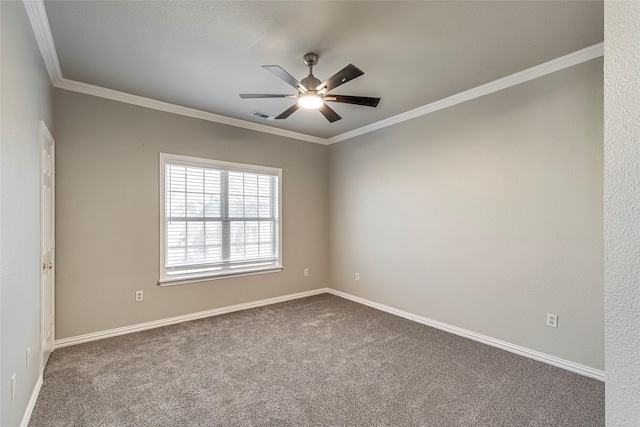 empty room featuring ceiling fan, ornamental molding, and carpet flooring