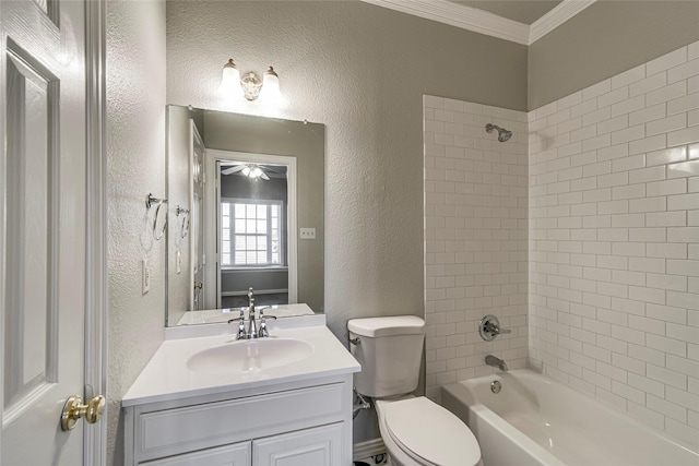 full bathroom featuring toilet, tiled shower / bath, crown molding, and vanity