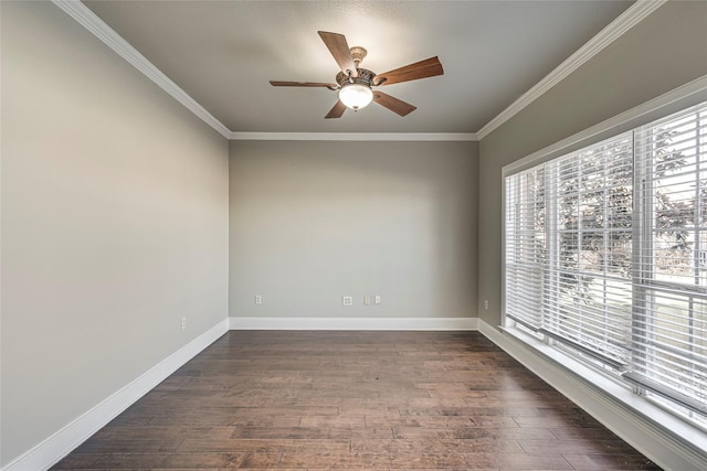 spare room with ceiling fan, dark hardwood / wood-style flooring, and crown molding