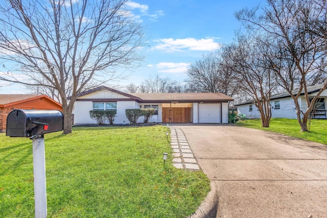 ranch-style house featuring a front yard and a garage