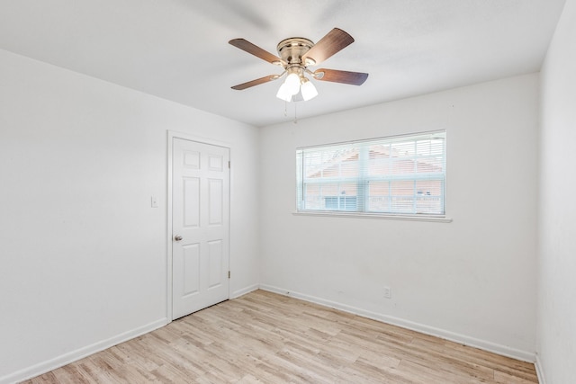 unfurnished room featuring ceiling fan and light wood-type flooring