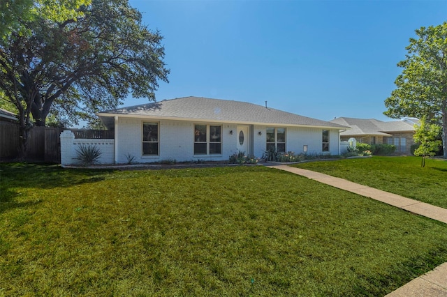 ranch-style house with a front lawn