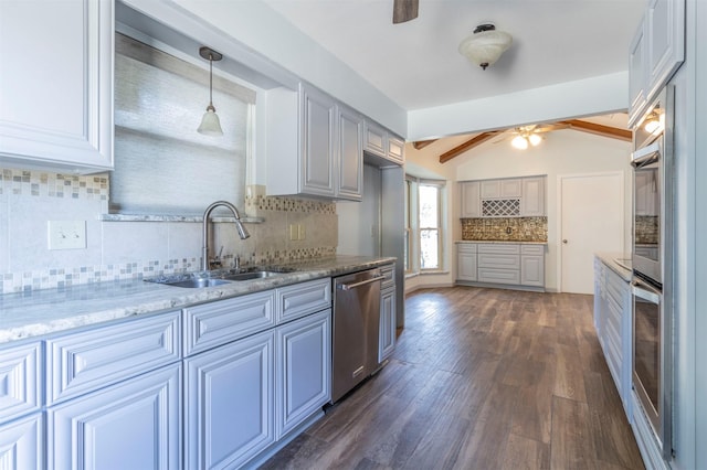 kitchen with sink, dishwasher, light stone counters, vaulted ceiling with beams, and hanging light fixtures