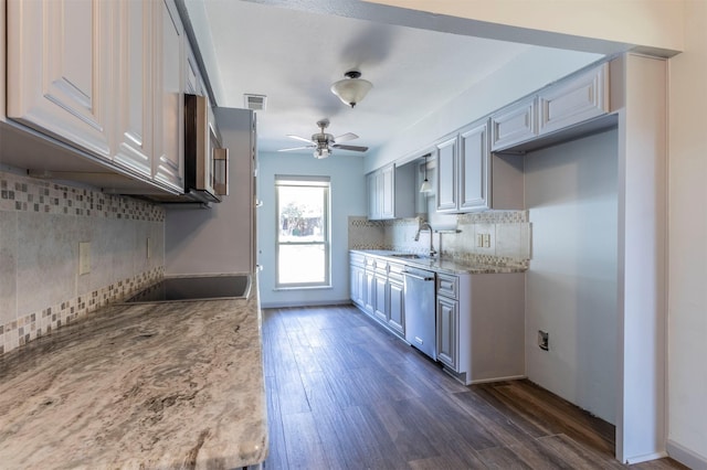 kitchen with sink, stainless steel dishwasher, backsplash, black electric cooktop, and dark wood-type flooring