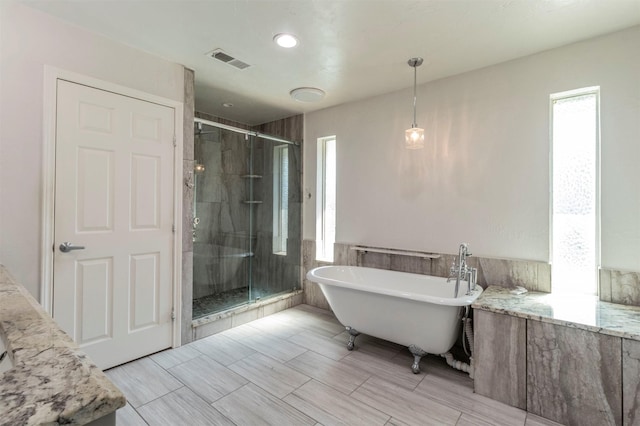 bathroom with independent shower and bath