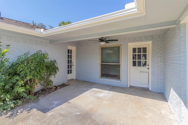 property entrance with ceiling fan and a patio