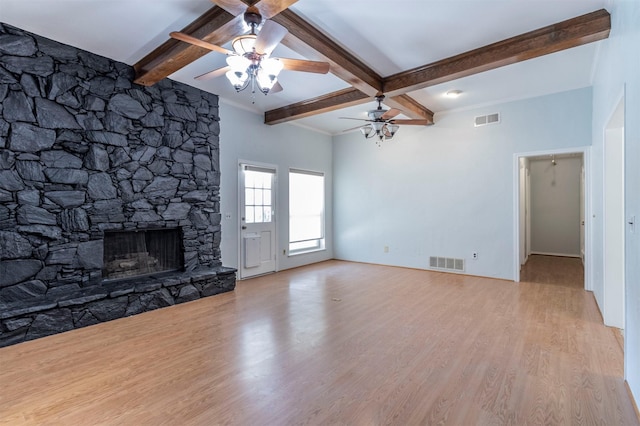 unfurnished living room with beam ceiling, ceiling fan, light hardwood / wood-style flooring, and a fireplace