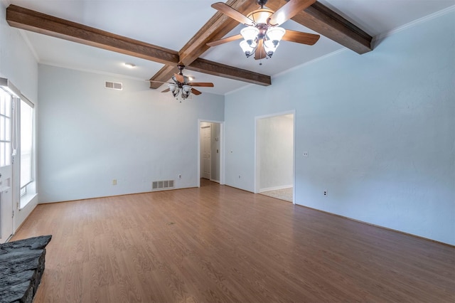 empty room featuring ceiling fan, crown molding, beamed ceiling, and light hardwood / wood-style flooring