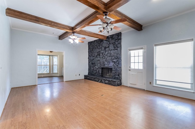 unfurnished living room featuring coffered ceiling, light hardwood / wood-style floors, beamed ceiling, ceiling fan, and a fireplace