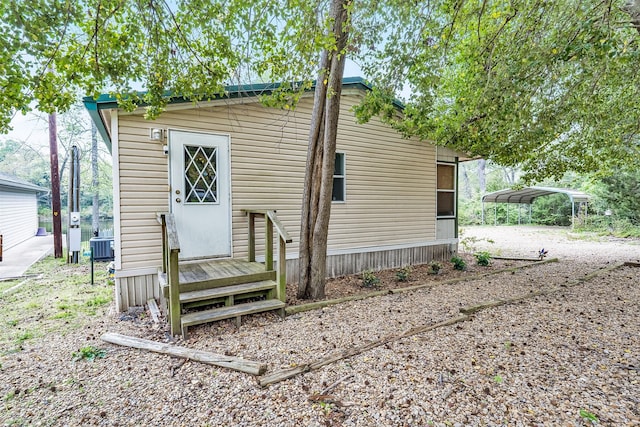 rear view of house with a carport