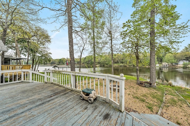 wooden deck with a water view