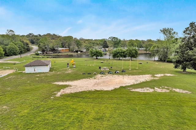 view of home's community featuring volleyball court and a water view