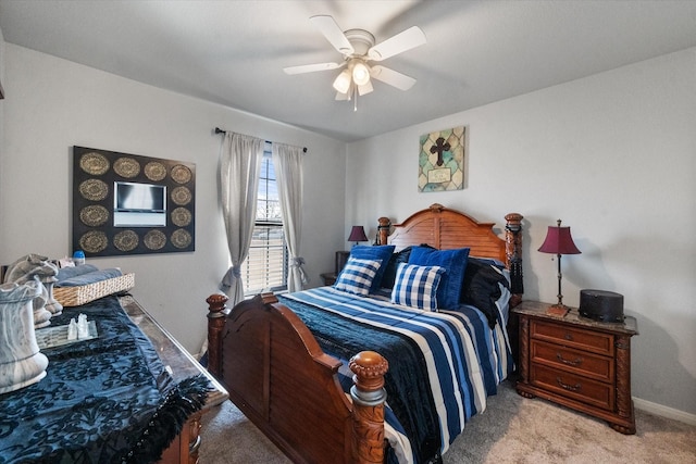 bedroom featuring light carpet, baseboards, and a ceiling fan