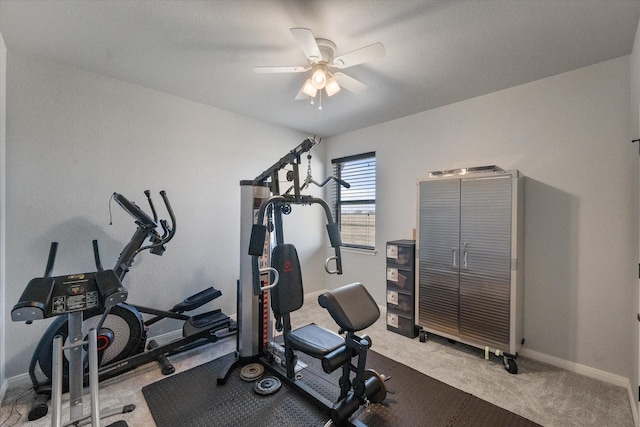 workout room featuring a ceiling fan, light colored carpet, and baseboards