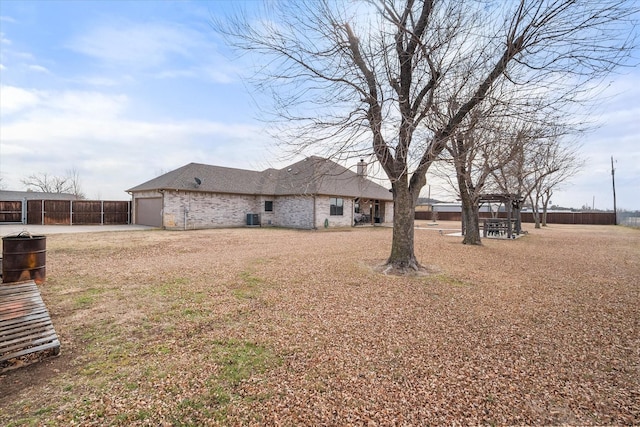 view of yard with a garage and fence