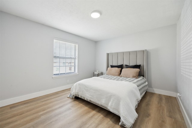 bedroom with light wood-type flooring