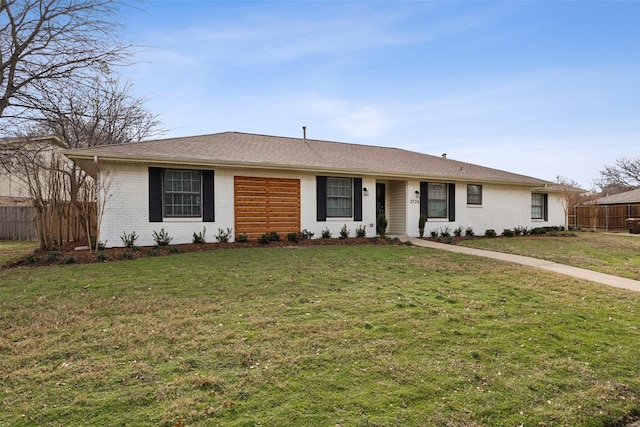 single story home with a front yard