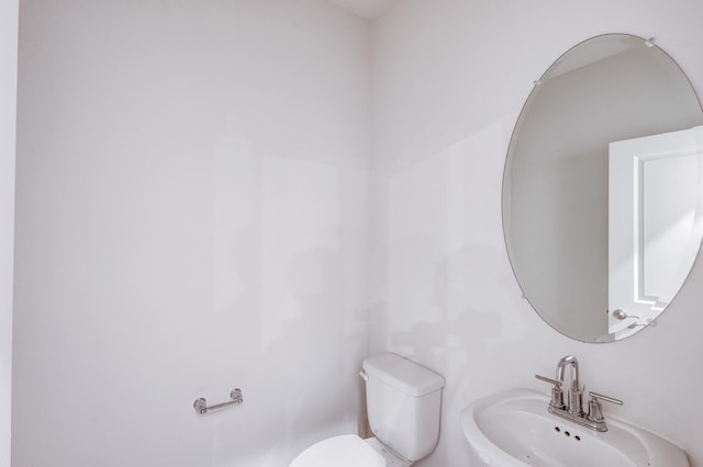 bathroom with toilet and sink