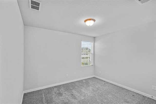 unfurnished room featuring carpet