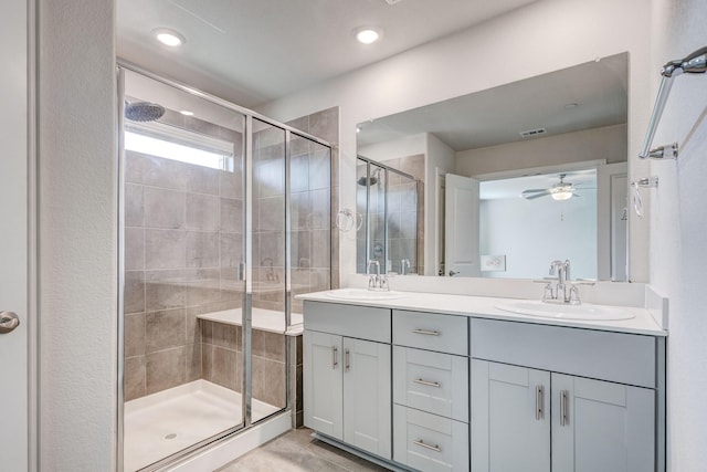 bathroom featuring ceiling fan, tile patterned floors, vanity, and a shower with shower door