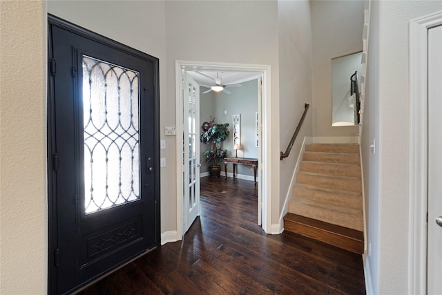 foyer with ceiling fan and dark hardwood / wood-style floors