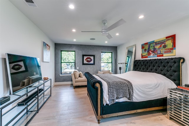 bedroom with light wood-type flooring and ceiling fan