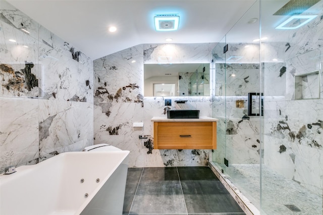 bathroom featuring vanity, tile walls, and separate shower and tub