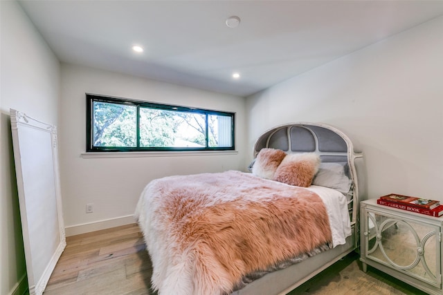 bedroom with light wood-type flooring