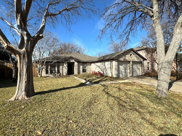 single story home featuring a front yard and a garage