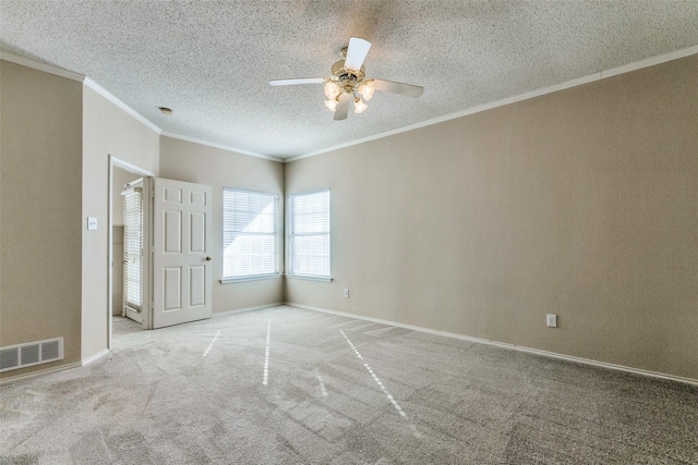 spare room with light carpet, ceiling fan, ornamental molding, and a textured ceiling