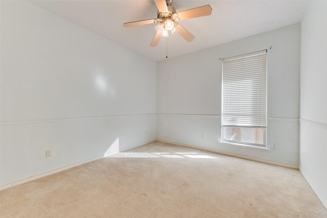 unfurnished room with ceiling fan and light colored carpet