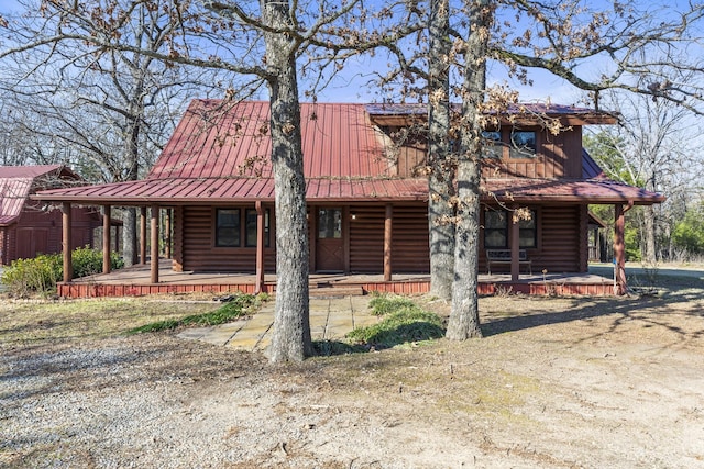 cabin featuring covered porch