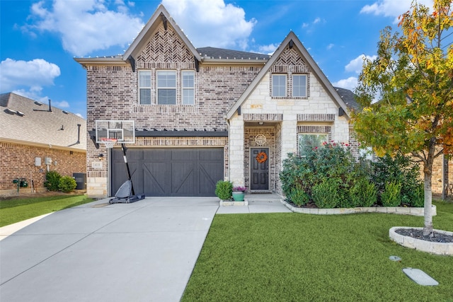 view of front of home featuring central air condition unit, a front lawn, and a garage