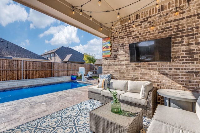 view of patio with a fenced in pool, outdoor lounge area, and a fenced backyard