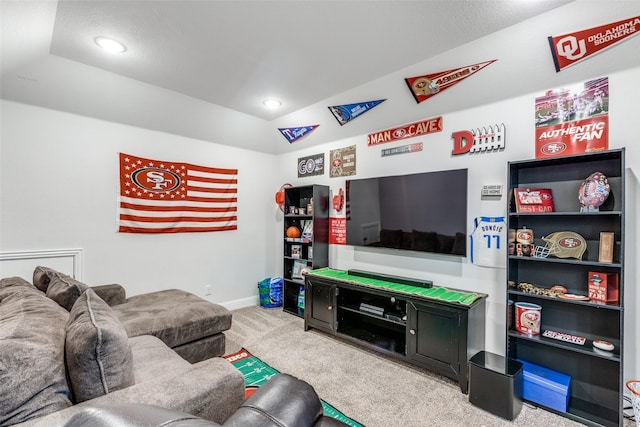 living room with lofted ceiling and carpet flooring