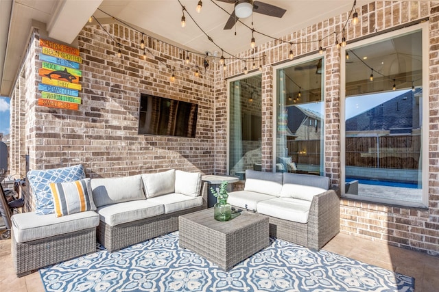 view of patio with ceiling fan and an outdoor hangout area