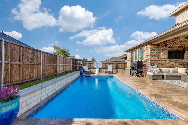 view of pool featuring an outdoor hangout area, area for grilling, and a patio area