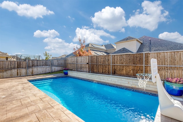 view of pool featuring a patio area