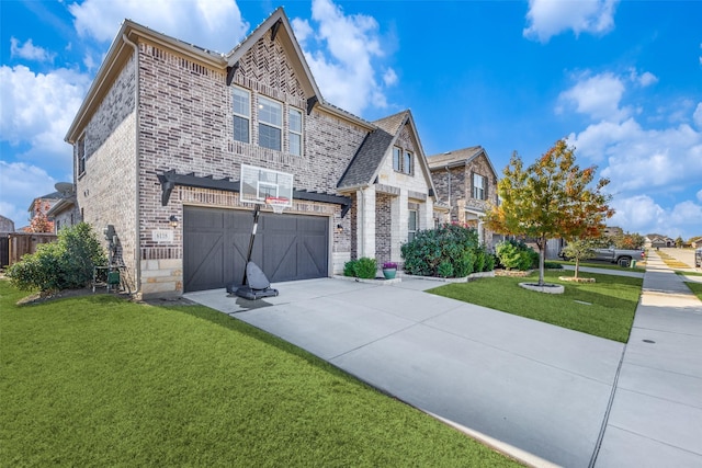 view of front of house featuring a front lawn and a garage