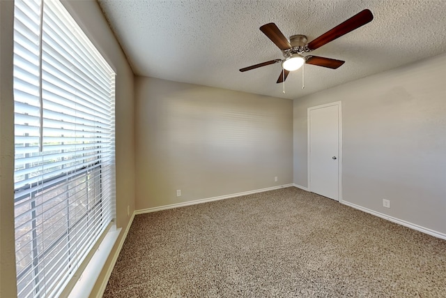 unfurnished room with a textured ceiling and ceiling fan